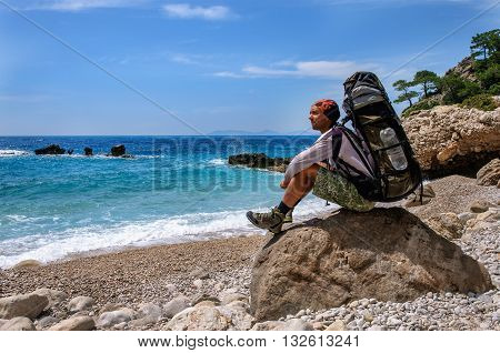Hiking in Turkey. Lycian Way. Backpacker by the sea. 