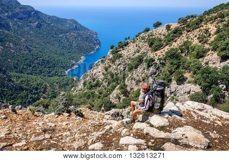 Hiking in Turkey. Lycian Way. Backpacker by the sea. The track is completed
