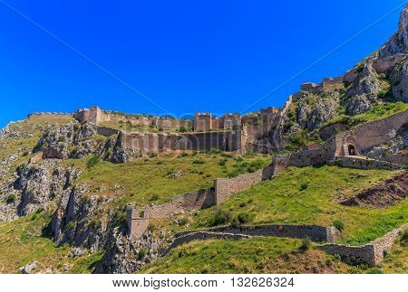 medieval fortress of Acrocorinth up on the hill against clear blue sky