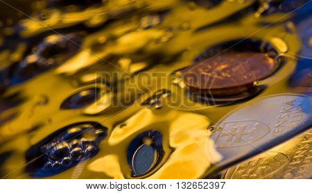 water to bubble, money in water, the gold river, coins of the different countries, indistinct