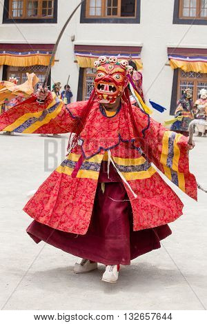 LAMAYURU INDIA - JUNE 13 2015: Unidentified buddhist lamas dressed in mystical mask dancing Tsam mystery dance in time of Yuru Kabgyat Buddhist festival at Lamayuru Gompa Ladakh North India