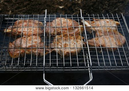 Meat on the bone grilled over charcoal.