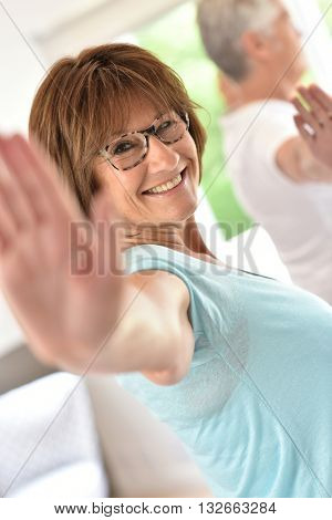 Senior people doing stretching exercices