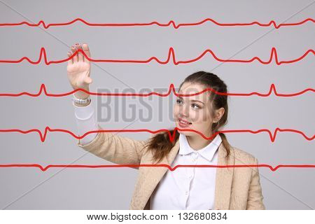 Doctor woman working with cardiogram lines