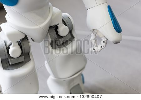 Sofia, Bulgaria - June 1, 2016: A small robot with human face and body - humanoid. Artificial Intelligence - AI. Blue robot. Hand and legs.