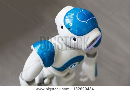 Sofia, Bulgaria - June 1, 2016: A small robot with human face and body - humanoid. Artificial Intelligence - AI. Blue robot.