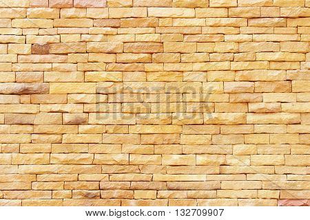 Sandstone wall backgroundPattern of Sandstone Brick Wall Surfaced