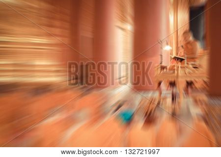 Blurred zoom of Thai monk worship in temple at Wat Thep Sirin Thrawat Ratchaworawihan. process in vintage style