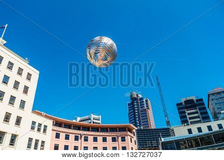 Wellington New Zealand - November 18 2014: Silver fern-patterned filagree suspended globe Civic Square Wellington New Zealand.