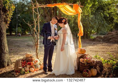 Bride and groom on their wedding fall day