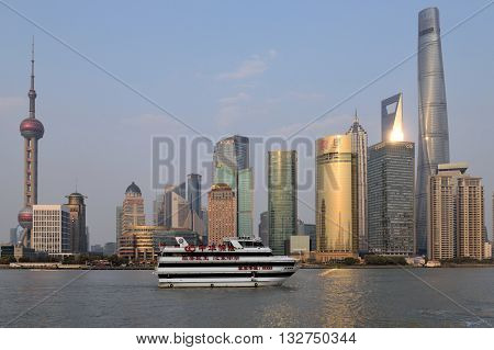 SHANGHAI CHINA - MARCH 25: Pudong district view from The Bund waterfront area on March 25 2016 in Shanghai China. Pudong is a district of Shanghai located east of the Huangpu River.