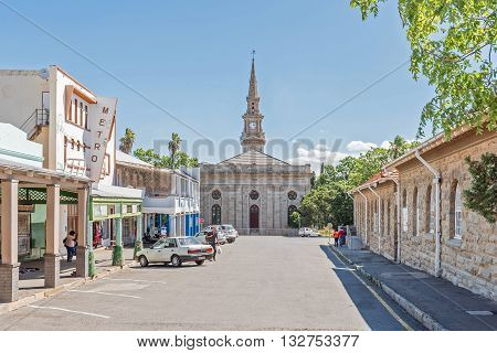 CRADOCK SOUTH AFRICA - FEBRUARY 16 2016: A street scene with businesses and the Dutch Reformed Church built in 1868. Cradock is a medium sized town in the Eastern Cape Province