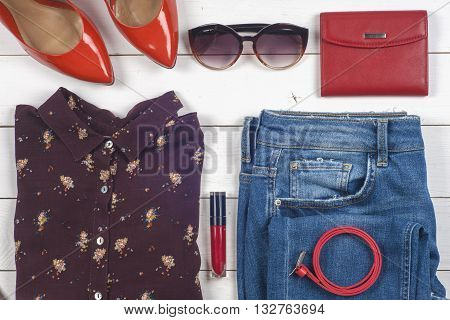 Women Clothing Set And Accessories On A Rustic Wooden Background.top View,  Different Shoes On  Ligh