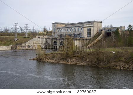 IVANGOROD, RUSSIA - MAY 01, 2015: View of the Narva power plant on a cloudy day. Historical landmark of the   Leningrad region