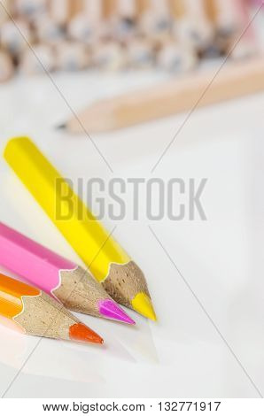 color pencils on white table backgroundsoft focus.