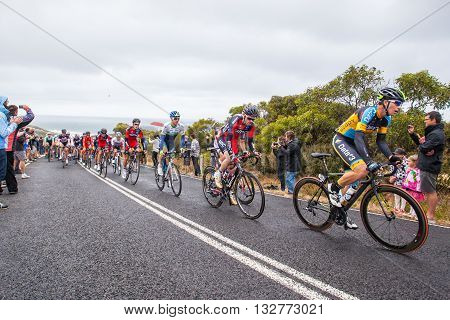 MELBOURNE, AUSTRALIA - FEBRUARY 1: The peloton passes the famous landmark of Bells Beach in the inaugral Cadel Evans Great Ocean Road Race