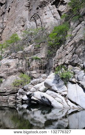 A rocky outcropping within the Heilong Pond area of the Lakeside Great wall scenic area in Beijing China.