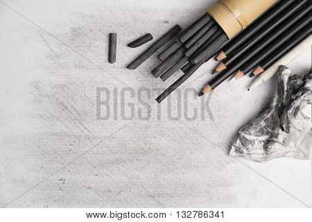 The Charcoal painting equipment on white canvas