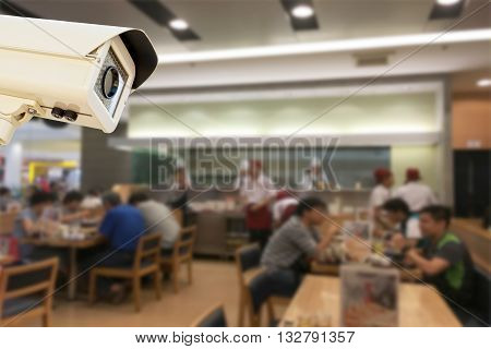 The CCTV Security Camera operating japaness restaurant blur background.