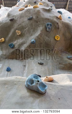 Close up artificial climbing wall in outdoor.