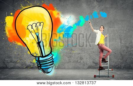 Young woman in casual drawing creativite idea concept on wall