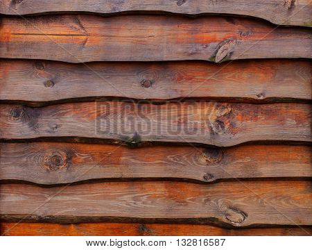 A fence made of pine boards. Covered with stains. wood texture.