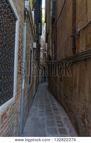 Very narrow old vintage street in Venice. Curvy narrow road in Venice that caused me fear.