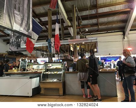 AUCKLANDJUNE 4: Food lovers gather to buy and taste top quality products from both New Zealand artisan producers and growers and from overseas at the La Cigale French Market in Auckland New Zealand on June 4 2016.