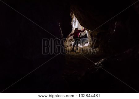 Woman Caver Spelunker Exploring The Cave