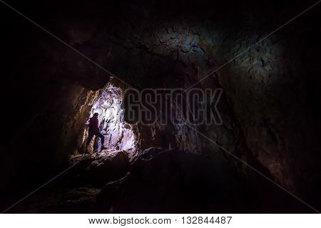 Woman Caver Spelunker Exploring The Cave