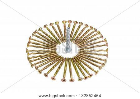 Zinc plated chipboard screws with countersunk heads stacked in a circle and a lag bolt in the center closeup on a light background