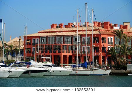 PUERTO SOTOGRANDE, SPAIN - JULY 18, 2008 - Yachts and boats in the marina with buildings to the rear Puerto Sotogrande Cadiz Province Andalucia Spain Western Europe, July 18, 2008.