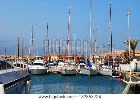 PUERTO SOTOGRANDE, SPAIN - JULY 18, 2008 - Yachts and boats in the marina with buildings to the rear Puerto Sotogrande Cadiz Province Andalucia Spain Western Europe, July 18, 2008.