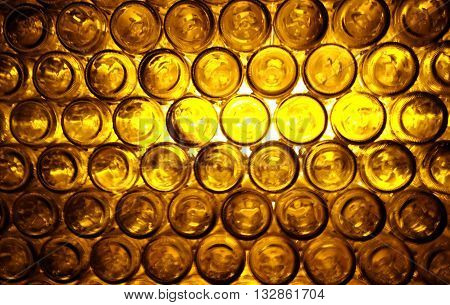 blur yellow light from bottom of bottles in bar