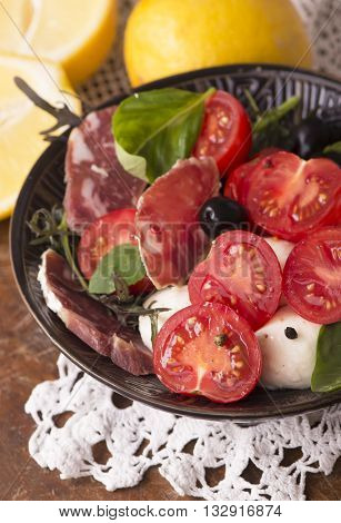 Homemade cooking traditional meat stew with beef lemon onions tomato.