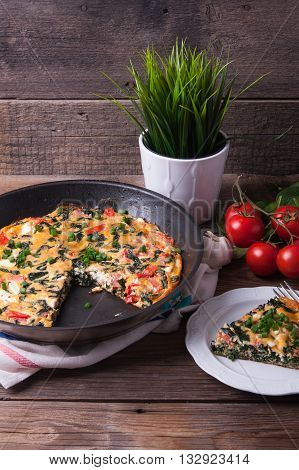 Frittata With Spinach, Tomatoes And Cheese