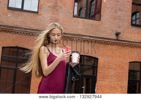 Young Pretty Blond Girl With Phone