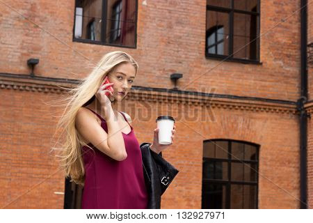 Young Pretty Blond Girl With Phone