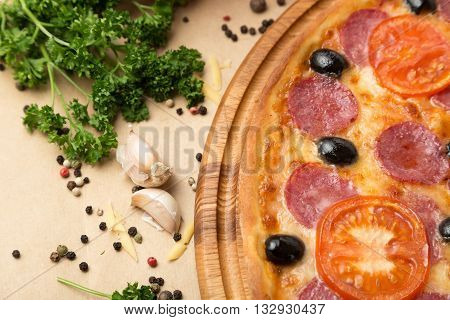 Delicious pizza served on table with vegetable