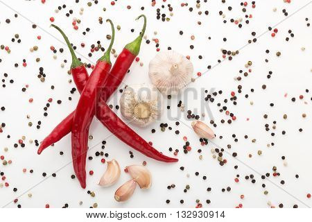 fresh chilli pepper with garlic on white