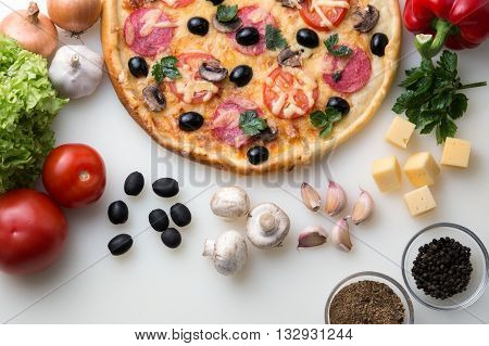 Delicious pizza served on table with vegetable