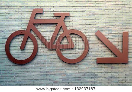 Bike route urban sign on brick wall