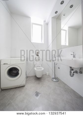wkite small but elegant half bathroom interior