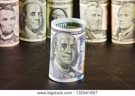 The President notes with one hundred dollars on a background of presidents from other denominations