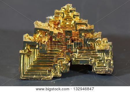 Macro photo of a crystallized piece of Bismuth metal.