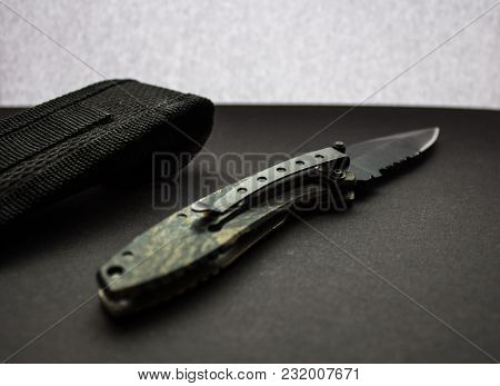 Hunting Knife With Case On Dark Background