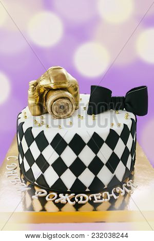 Black And White Birthday Cake For Photographer On Violet Background. With Russion Inscription Happy 