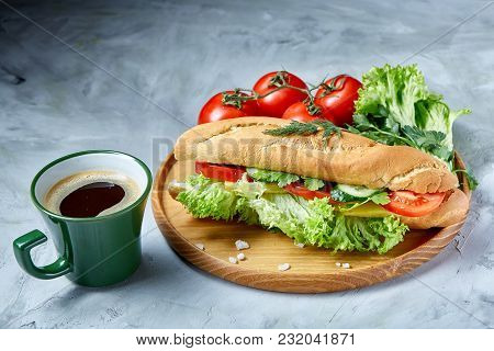 Fresh Homemade Sub Sandwich With Lettuce, Tomatoes And Cheese Served With Fresh Tomatoes, Cup Of Ref