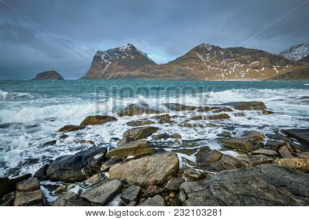 Rocky coast of fjord of Norwegian sea in winter. Lofoten islands, Norway