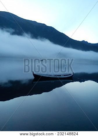Romantic Evening On The Water. It Is Taken In The Evening, A Little Bit Romanitc. There Are A Few Ca